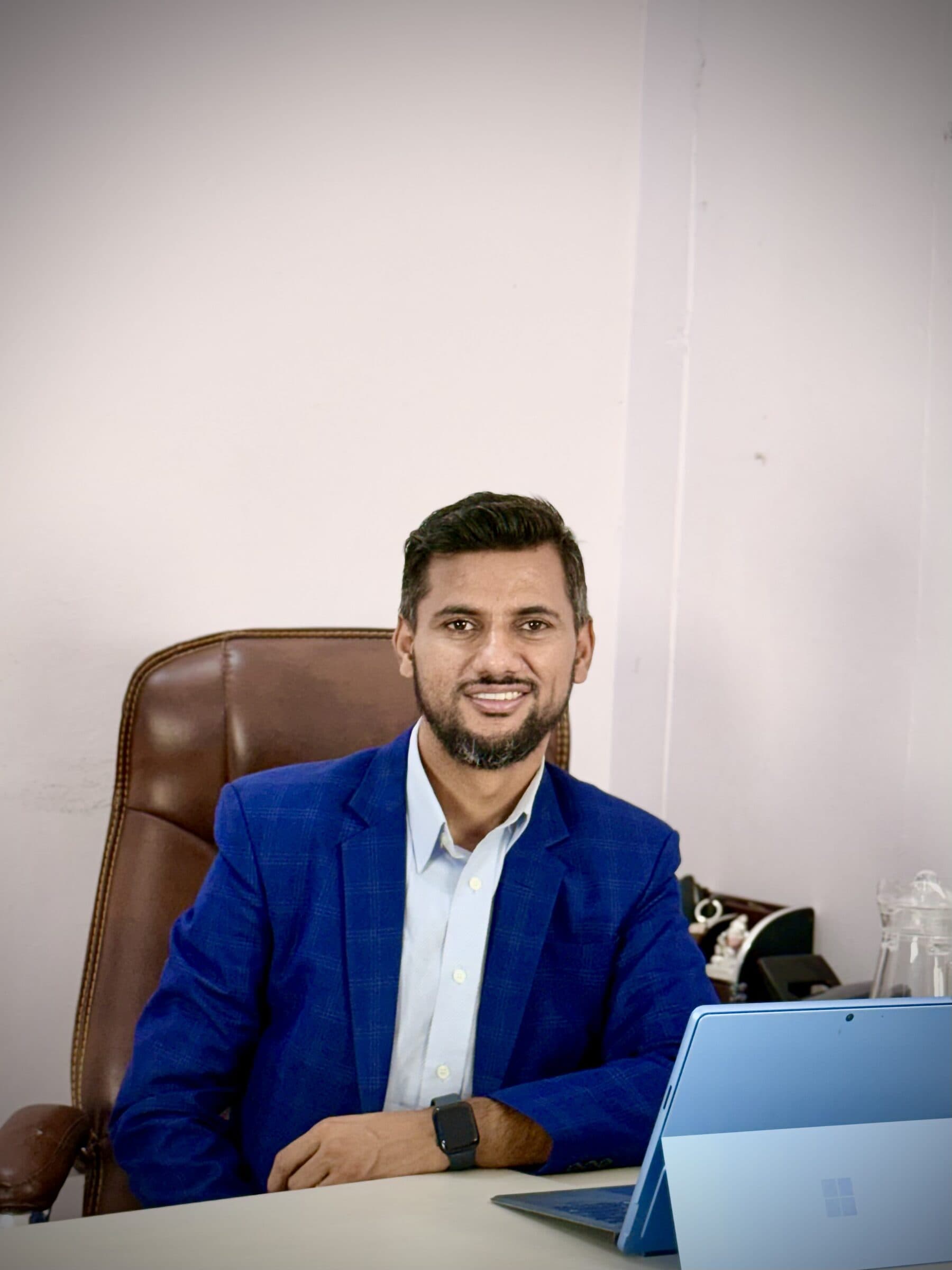 B3S team member at his desk