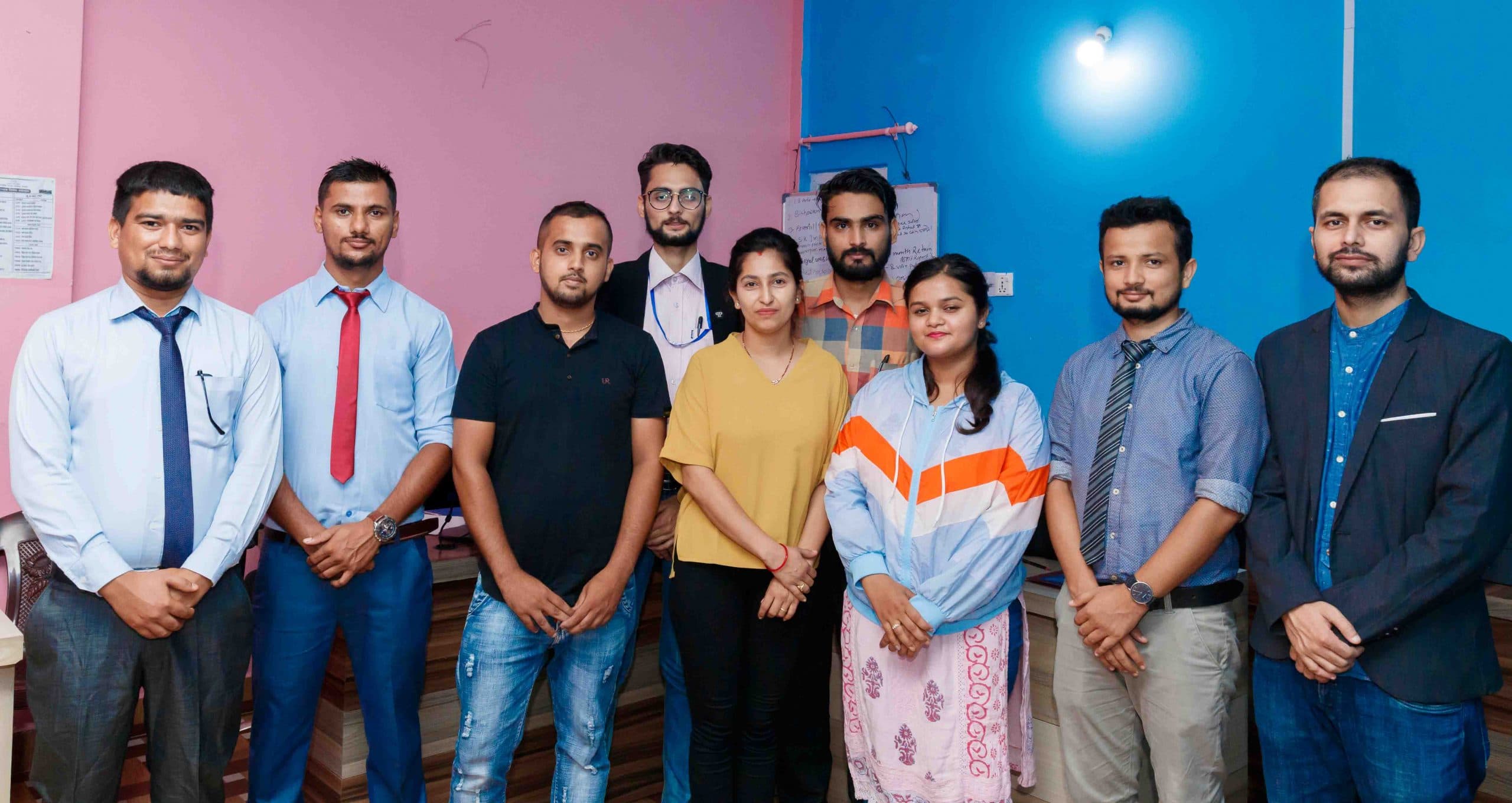 B3S team members standing together in the office